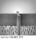 Team leadership success or border agreement concept as the leaders of two divided groups of employees or citizens overcoming high walls to find a solution to meet and agree to shake hands in a mutual friendly cooperation. Стоковое фото, агентство Ingram Publishing / Фотобанк Лори