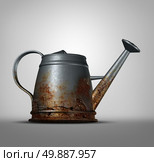 Water problem as a watering can that is corroded and decaying with with rust due to neglected weathering and oxidation as a conservation and health metaphor for clean drinking liquid free from lead and poison. Стоковое фото, агентство Ingram Publishing / Фотобанк Лори