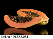 Fresh and tasty papaya on black background. Стоковое фото, агентство Ingram Publishing / Фотобанк Лори