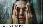 A woman with her hands pressed against her face in a gesture of concern, stress, or sadness. Стоковое AI-изображение, AI-художник Данила Большаков / Фотобанк Лори