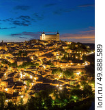 Panorama shot of Toledo Cityscape with Alcazar at dusk in Madrid Spain. Стоковое фото, агентство Ingram Publishing / Фотобанк Лори