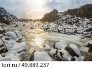 Oxararfoss Waterfall in the winter in pingvellir valley  National Park in Iceland. Стоковое фото, агентство Ingram Publishing / Фотобанк Лори