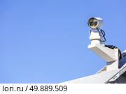 CCTV security camera over blue sky. Стоковое фото, агентство Ingram Publishing / Фотобанк Лори