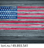 American remembrance day background rustic antique USA flag painted on old weathered wood as a patriotic symbol for memorial day observance as a traditional holiday symbol to honor the veterans in a 3D illustration style. Стоковое фото, агентство Ingram Publishing / Фотобанк Лори