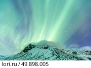 Northern Lights Aurora borealis at Vik Iceland. Стоковое фото, агентство Ingram Publishing / Фотобанк Лори