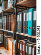 Several binders neatly arranged on a shelf, showcasing organization and storage of documents in an office or workspace. Стоковое AI-изображение, AI-художник Данила Большаков / Фотобанк Лори