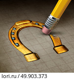 Luck loss concept and misfortune symbol as an eraser erasing a lucky horseshoe icon as a metaphor for unfortunate adversity as a 3D illustration. Стоковое фото, агентство Ingram Publishing / Фотобанк Лори
