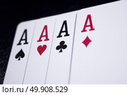 ace four of a kind poker card on dark black background. Стоковое фото, агентство Ingram Publishing / Фотобанк Лори