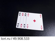ace four of a kind poker card on dark black background. Стоковое фото, агентство Ingram Publishing / Фотобанк Лори