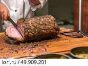 Carving of Wagyu beef roast. Стоковое фото, агентство Ingram Publishing / Фотобанк Лори
