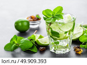 Mojito Cubano or caipirinha cocktail, iced drink with lime and mint. Стоковое фото, агентство Ingram Publishing / Фотобанк Лори