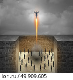 Career boost business concept as a businessman taking off as a rocket from a group of company workers trapped in walls as a metaphor for entrepreneur achievement and ambition freedom with 3D illustration elements. Стоковое фото, агентство Ingram Publishing / Фотобанк Лори