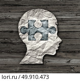 Childhood education or mental disorder in the brain of a child as epilepsy add or adhd or autism symbol as a crumpled paper with a puzzle piece shaped as the head of a kid in a 3D illustration style. Стоковое фото, агентство Ingram Publishing / Фотобанк Лори