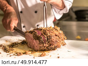 Carving of Wagyu beef roast. Стоковое фото, агентство Ingram Publishing / Фотобанк Лори