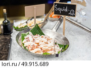 Squid cuttlefish seafood on ice. Стоковое фото, агентство Ingram Publishing / Фотобанк Лори
