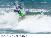 Kiteboarder enjoy surfing on a sunny day. Стоковое фото, агентство Ingram Publishing / Фотобанк Лори