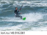Kiteboarder enjoy surfing on a sunny day. Стоковое фото, агентство Ingram Publishing / Фотобанк Лори