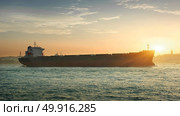 Tanker in the waters of Bosphorus in Istanbul at sunset, Turkey. Стоковое фото, агентство Ingram Publishing / Фотобанк Лори