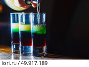 Preparation of shots cocktails. Close-up. Стоковое фото, агентство Ingram Publishing / Фотобанк Лори