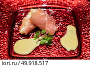Arranged small ball : Deep fried  European pear tempura with Prosciutto parma ham. Стоковое фото, агентство Ingram Publishing / Фотобанк Лори