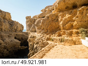 A pool of natural sea water between sandstone cliffs at Algar Seco. Carvoeiro Algarve Portugal. Стоковое фото, агентство Ingram Publishing / Фотобанк Лори