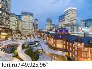 Landscape of Tokyo Station at dusk with building skyline. Стоковое фото, агентство Ingram Publishing / Фотобанк Лори