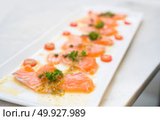 Salmon Fish Raw salmon fillet pepper salt dill lemon rosemary on plate. Стоковое фото, агентство Ingram Publishing / Фотобанк Лори