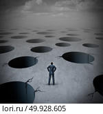 Pitfall concept as a vulnerable businessman facing risky business peril deep holes as an uncertainty stress idea with 3D illustration. Стоковое фото, агентство Ingram Publishing / Фотобанк Лори