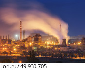 Metallurgical plant at night. Steel factory with smokestacks. Steelworks, iron works. Heavy industry in Europe. Air pollution from smokestacks, ecology problems. Industrial landscape at dusk. Plant. Стоковое фото, агентство Ingram Publishing / Фотобанк Лори