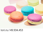 Colorful macarons on white background. Macaron is sweet meringue-based confection. Стоковое фото, агентство Ingram Publishing / Фотобанк Лори