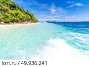 Tropical white sand beach. Tropical white sand beach at snoekel point from speed boat at andaman sea indian ocean Myanmar and Thailand. Стоковое фото, агентство Ingram Publishing / Фотобанк Лори