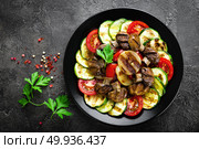 Salad with fresh and grilled vegetables and mushrooms. Vegetable salad with grilled champignons. Vegetable salad on plate. Стоковое фото, агентство Ingram Publishing / Фотобанк Лори