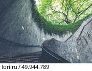 Travel in Singapore .Spiral staircase of underground crossing in tunnel at Fort Canning Park, Singapore. Singapore is most popular travel city in Southeast asia. Стоковое фото, агентство Ingram Publishing / Фотобанк Лори