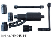 Manual torque multiplier wrench set with sockets and handle on white background, ideal for loosening tight lug nuts on trucks or heavy vehicles. Стоковое фото, фотограф Татьяна Терехина / Фотобанк Лори