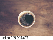 Cup of Dripping fresh hot coffee on the wood table. Стоковое фото, агентство Ingram Publishing / Фотобанк Лори