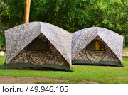 Campsite tent on filed for travel background. Стоковое фото, агентство Ingram Publishing / Фотобанк Лори