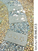 Garden stone path with grass growing up between and around stones, Brick Sidewalk. Garden stone path with grass growing up between and around stone. Стоковое фото, агентство Ingram Publishing / Фотобанк Лори