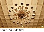 Simple chandelier bottom view with vintage ceiling background. Стоковое фото, агентство Ingram Publishing / Фотобанк Лори