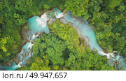 Aerial view of river and waterfalls with unreal blue water in Costa Rica forest. Стоковое видео, видеограф Igor Tichonow / Фотобанк Лори