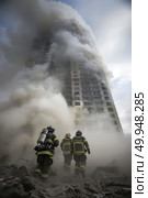 Group of firemen in uniform standing in front of a high-rise building, ready for action. Стоковое AI-изображение, AI-художник Данила Большаков / Фотобанк Лори