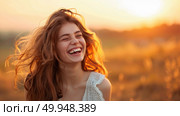 A carefree and happy young woman laughs with hair tousled by the breeze as the sun sets, lighting up the field behind her. Стоковое AI-изображение, AI-художник Данила Большаков / Фотобанк Лори