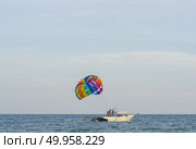 PHUKET, THAILAND -Jul 5 2016: An unidentified Paramania Paramotor show in Children day. Photo at Phuket, Thailand. Редакционное фото, агентство Ingram Publishing / Фотобанк Лори