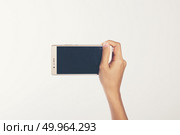 Close Up of a woman holding on mobile phone isolated on white ba. Close Up of a woman holding on mobile phone isolated on white background. Стоковое фото, агентство Ingram Publishing / Фотобанк Лори