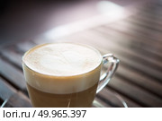 Close up of cappuccino cup with heart shaped milk pattern at caf. Close up of cappuccino cup with heart shaped milk pattern at cafe. a cup of coffee art. Стоковое фото, агентство Ingram Publishing / Фотобанк Лори