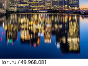 Skylines building at Canary Wharf in London UK sunset twilight. Стоковое фото, агентство Ingram Publishing / Фотобанк Лори