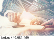 exposure image, A Person’s Hand Stamping With Approved Stamp On Document At Desk. Стоковое фото, агентство Ingram Publishing / Фотобанк Лори