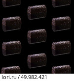 Chocolate candies on a black background. pattern of chocolates. Стоковое фото, агентство Ingram Publishing / Фотобанк Лори
