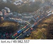Podil, Vozdvizhenka district, top view of new modern houses with colorful roofs and construction. Kiev, Ukraine. Drone photo. Top view of new modern houses in Vozdvizhenka district, Kiev, Ukraine. Стоковое фото, агентство Ingram Publishing / Фотобанк Лори