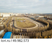 Aerial photography from the drone to the infrastructure of the racecourse in Kiev, Ukraine, a shot in the early spring in cloudy weather.. Panoramic aerial view from the drone, a view of the bird’s eye to the Central Hippodrome of Ukraine in the city of Kiev. Стоковое фото, агентство Ingram Publishing / Фотобанк Лори