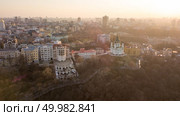 Aerial panorama view Kiev city in evening sunset with St Andrew’s Church, Ukraine. Drone photo. Panorama of Kiev and St. Andrew’s Church on sunset, Ukraine. Стоковое фото, агентство Ingram Publishing / Фотобанк Лори